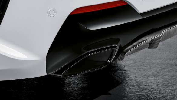 Ornamentul pentru ţeava de eşapament, în negru lucios, stânga ale BMW Seria 4 Coupé G22 2020 Imagine în prim plan cu ornamentul pentru ţeava de eşapament, în negru lucios, stânga ale BMW Seria 4 Coupé G22 2020