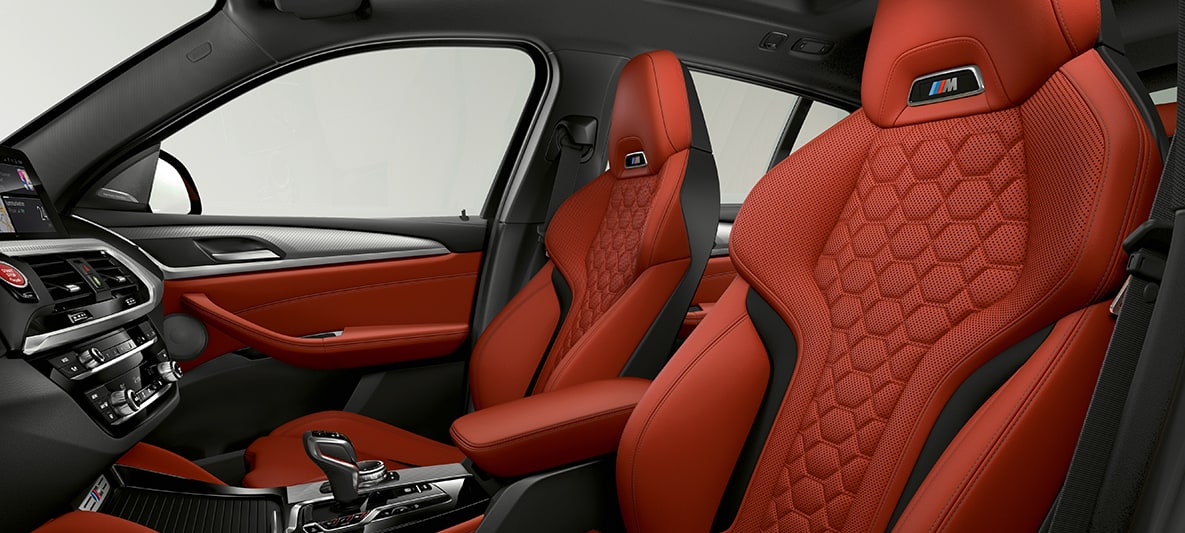 Imagine BMW X4 M, cu scaune Sport din piele Merino în Portocaliu Sakhir. Imagine cu interiorul BMW X4 M, cu scaune Sport din piele Merino în Portocaliu Sakhir.