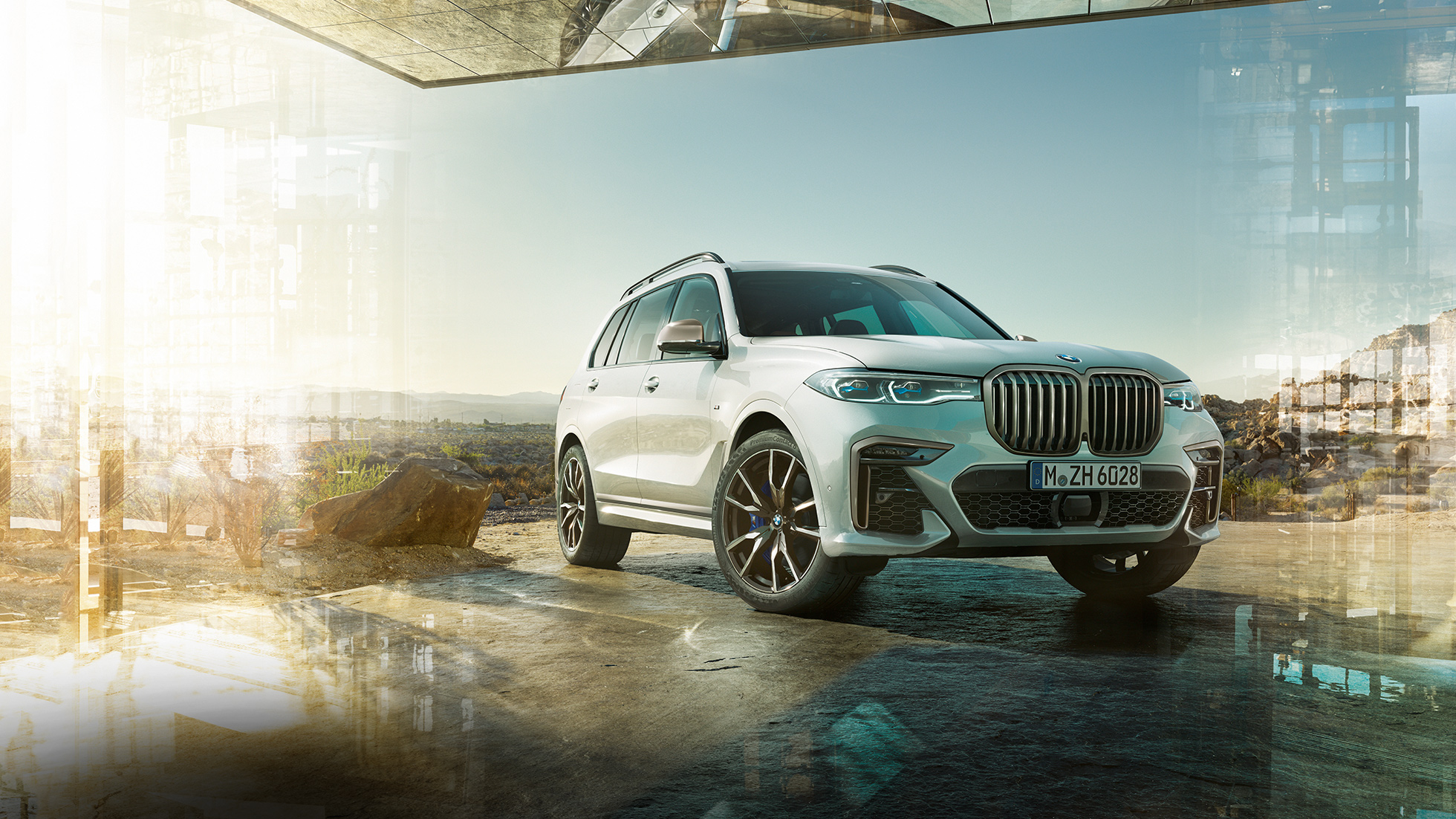 Imagine cu trei sferturi din partea frontală a BMW X7 M50d BMW X7 M50d: imagine cu trei sferturi din partea frontală a BMW X7 alb, staţionând